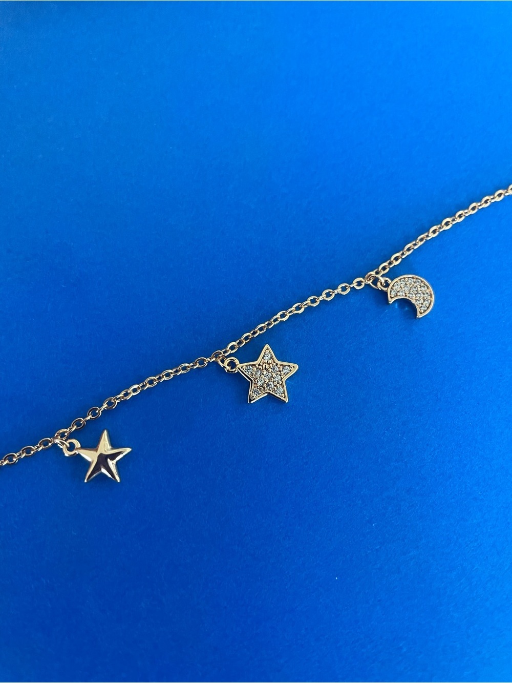 Gold Star & Moon Charm bracelet in Gold Tone